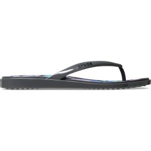 May include: A pair of dark gray flip-flops with a floral design on the footbed. The flip-flops have a thong-style strap and the brand name "crocs" is printed on the strap.