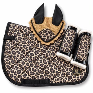 May include: A quilted horse saddle pad with a leopard print pattern, black trim, and a matching crochet ear bonnet with black ears. Two black glossy leg boots with white faux fur lining are included, featuring a Best Horse logo patch.