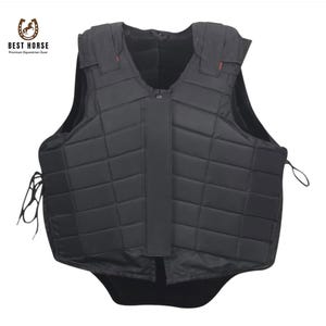 May include: Black equestrian safety vest with a quilted pattern. The vest features a zip closure and adjustable straps. The Best Horse logo is visible. This protective gear is designed for horse riding.