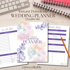 May include: A wedding planner with a watercolour design, featuring pages for planning and notes. The planner includes a cover with the text "Wedding Planner" and "US Letter size". The image also shows a keyboard, paperclips, and a pencil.
