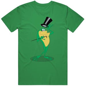 May include: Green t-shirt featuring a cartoon frog in a top hat, holding a cane. The frog is green and yellow, with a black top hat. The t-shirt is a solid green color.