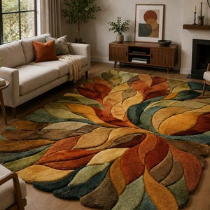 May include: A large rectangular area rug featuring a textured, multi-layered leaf pattern in shades of burnt orange, mustard yellow, olive green, and deep teal. The rug has a thick, plush pile with carved edges that define each individual leaf shape.