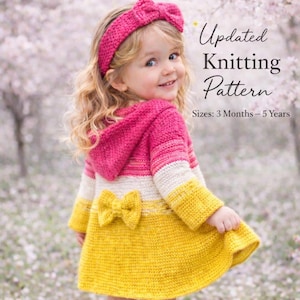 May include: A young child in a pink and yellow knitted coat and headband. The coat features a hood and a bow. The image includes the text "Updated Knitting Pattern" and "Sizes: 3 Months - 5 Years."