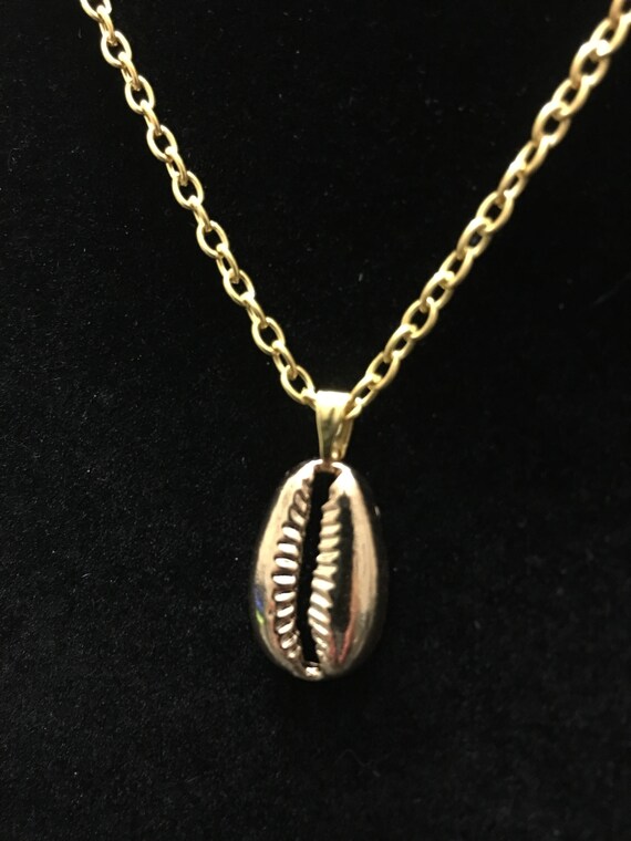 Gold West African Cowrie Shell Charm Cultural Pendant Designer Jewelry Necklace 19 Inches - Gold Chain Pendant Designs Gold West African Cowrie Shell Charm Cultural Pendant Designer Jewelry Necklace 19 Inches - Gold Chain Pendant Designs