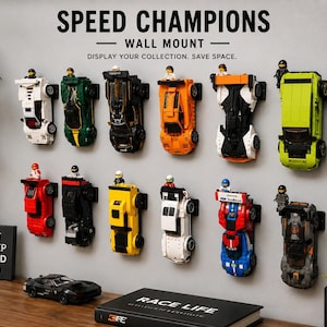 May include: A set of black plastic wall mounts displaying twelve toy race cars in various colors including white, green, black, orange, and blue. Each car features a small driver figure. Text reads SPEED CHAMPIONS WALL MOUNT and EAT SLEEP BUILD.