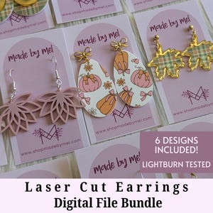 May include: A selection of laser-cut earring designs presented on cards. The earrings showcase diverse shapes and patterns, including floral, plaid, and pumpkin motifs. The cards display the text "Made by Mel" and "www.shopmadebymel.com". The text "6 Designs Included!" is also visible.