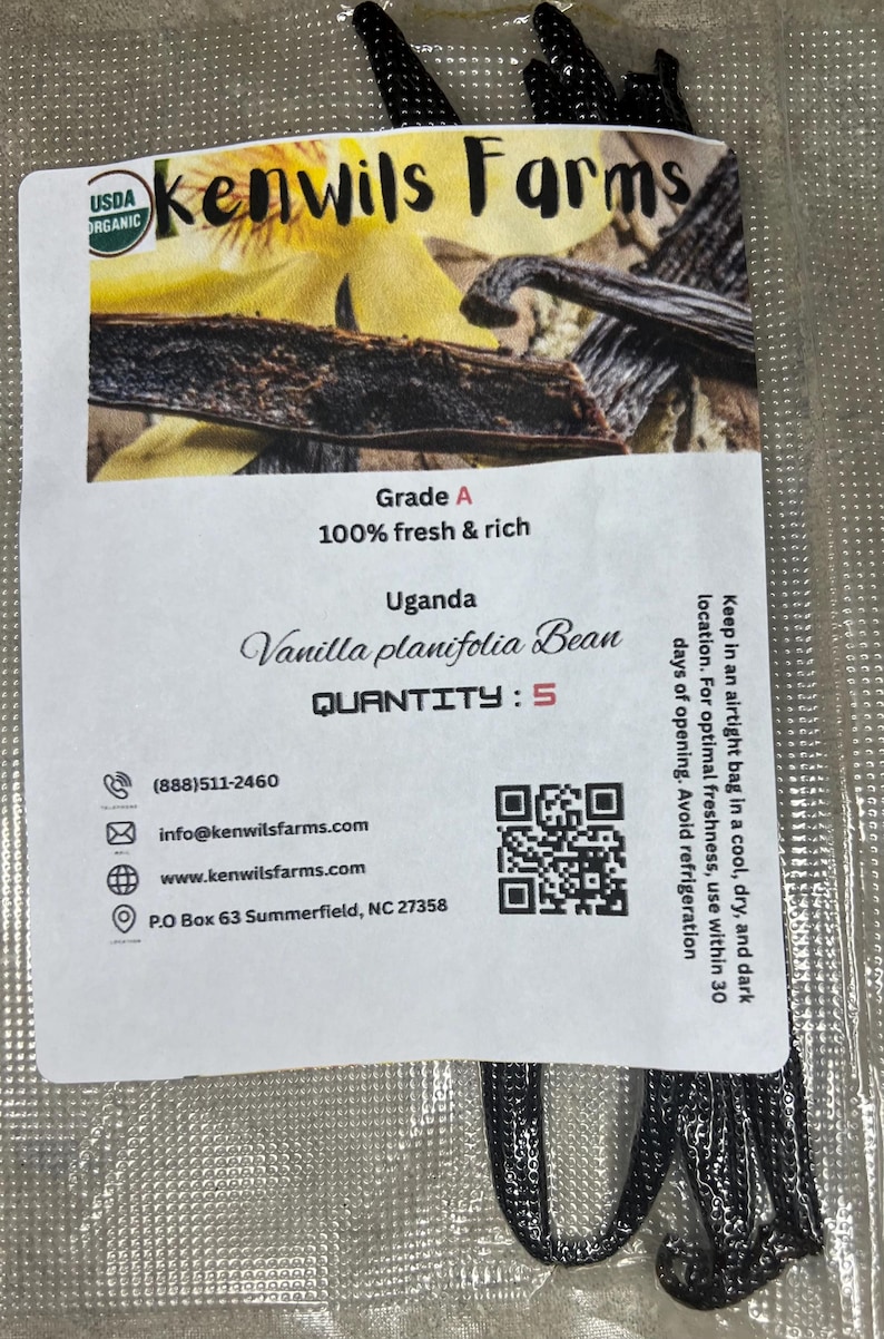 May include: A packet of Kenwils Farms organic vanilla beans. The label states "Grade A, 100% fresh & rich" and "Vanilla planifolia Bean" from Uganda. The quantity is 5. The package also includes contact information and a QR code.