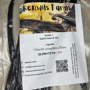 May include: A packet of Grade A Uganda Vanilla planifolia beans. The label reads "kenwils Farms" and "100% fresh & rich". The quantity is 20. The packet also includes contact information and a QR code.