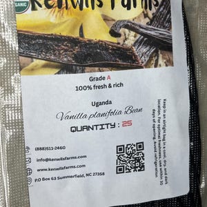 May include: A packet of Grade A vanilla beans from Kenwils Farms. The label states the beans are from Uganda, with a quantity of 25. The packaging includes contact details and a QR code.