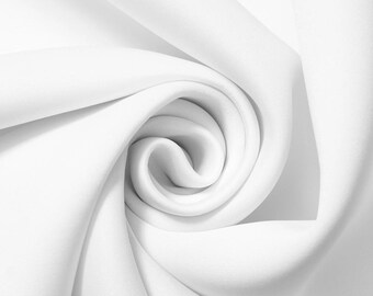 Puede incluir: Primer plano de una tela blanca, dispuesta en espiral. La textura suave y el color blanco brillante de la tela crean una sensación de elegancia y pureza. Los pliegues y curvas de la tela crean un patrón dinámico y visualmente atractivo.