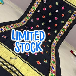May include: Black textile with gold trim and colourful embroidered details. The textile features a repeating pattern of small, colourful embroidered circles. The words "LIMITED STOCK" are displayed in large, blue, outlined letters.