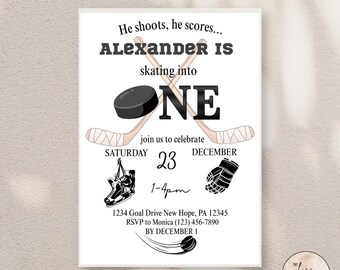 May include: White invitation card with a hockey theme. The text reads "He shoots, he scores... ALEXANDER IS skating into ONE." Includes hockey sticks, a puck, a skate, a glove, and event details.