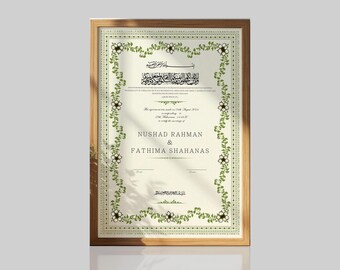 May include: A framed marriage certificate with a cream-colored background, featuring a green floral border and black Arabic and English text. The document includes the names Nushad Rahman and Fathima Shahanas, dated August 14th, 2024, in a wooden frame.