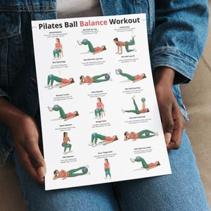 May include: A white Pilates Ball Balance Workout poster with illustrations of exercises. The poster features various exercises with a small blue ball, including Seated Balance, Mini Ball Toe Tap, and Donkey Kick. The text is in black.