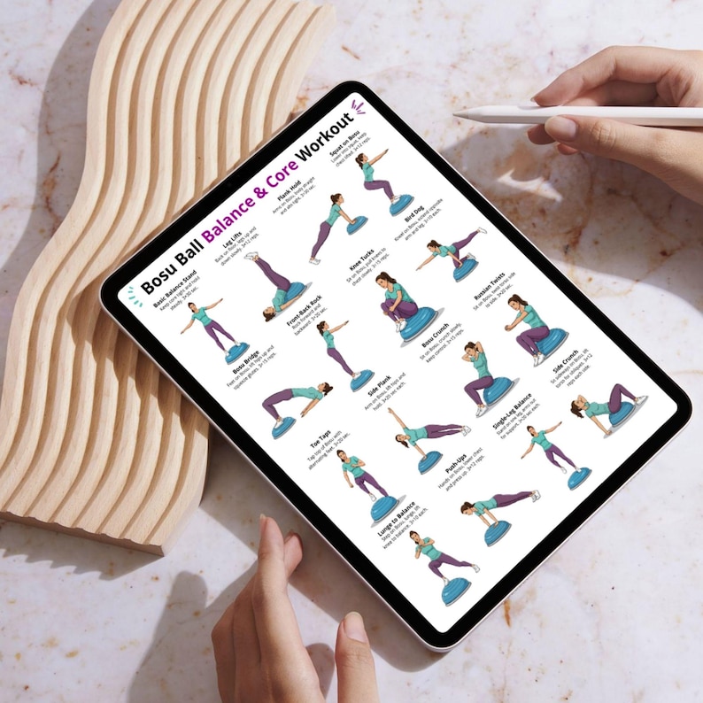 May include: A digital tablet showing a "Bosu Ball Balance & Core Workout" guide. The guide features illustrated exercises with women demonstrating each move. The tablet is held by a person with a stylus nearby.