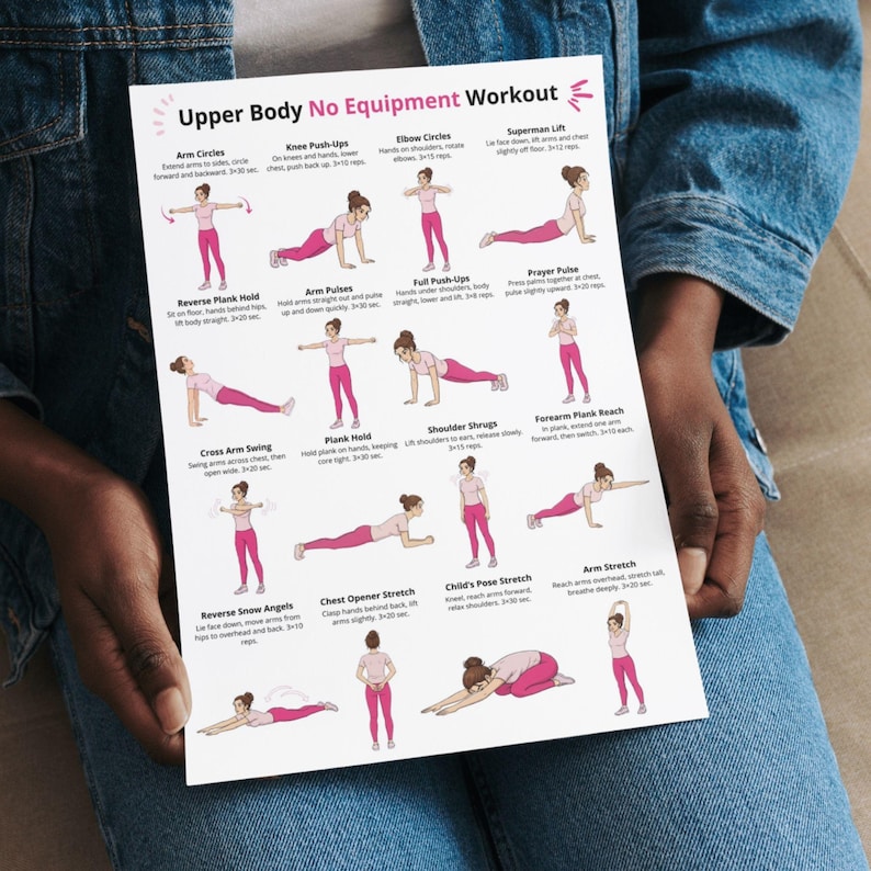 May include: A white printed workout guide titled "Upper Body No Equipment Workout" held by a person. The guide features illustrations of various exercises, including arm circles, push-ups, and stretches. The exercises are demonstrated by figures in pink attire.