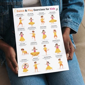 May include: A white poster titled "Dance & Play Exercises for Kids" featuring colorful illustrations of children performing various exercises. The exercises include jumping, spinning, and marching. The poster is held by a person wearing a denim jacket.