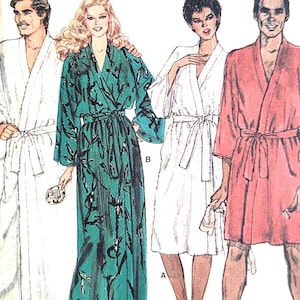 May include: A vintage sewing pattern labelled "Very Easy Very Vogue." The pattern shows illustrations of four people in robes. The robes are white, teal with black floral print, and red. The size is small.