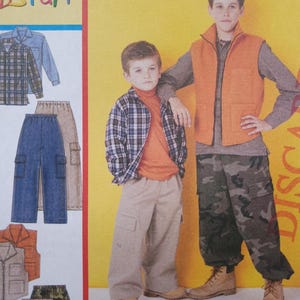 May include: Two boys in casual outfits. One wears a plaid shirt, orange turtleneck, and beige trousers. The other wears an orange vest, grey shirt, and camouflage trousers. Clothing patterns are also visible in the image.