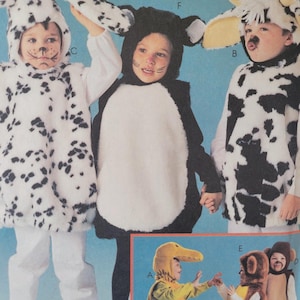 May include: A selection of children's animal costumes, including a Dalmatian, cow, and cat. The costumes have hoods with ears and are made of soft, plush fabric. The Dalmatian costume is white with black spots, the cow costume is black and white, and the cat costume is black and white.