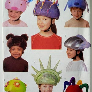 Butterick 6737 Sewing Pattern for Kids Helmet Covers Pig Bear Dinosaur Flowers Jester Statue of Liberty