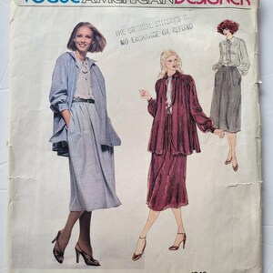 May include: A vintage Vogue American Designer sewing pattern by Bill Blass. The cover shows illustrations of women's clothing, including a coat, skirt, and jacket. The cover is off-white with text that reads "Vogue American Designer" and "Bill Blass."