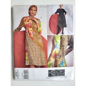 May include: A sewing pattern envelope showing a woman in a patterned dress. The envelope includes images of the dress and the text "KOOS VAN DEN AKKER VOGUE AMERICAN DESIGNER". The pattern number is 2713.