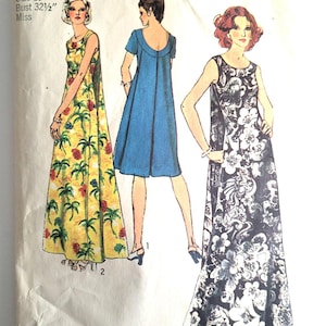 May include: Vintage Simplicity sewing pattern, size 10, bust 32.5 inches. The pattern features illustrations of three different maxi dresses. One dress is yellow with a tropical print, another is solid blue, and the third is black and white floral.