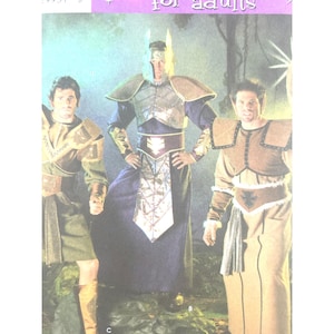 Könnte beinhalten: Drei Personen in Fantasy-Kostümen. Die Kostüme umfassen Rüstungen, Roben und Kopfbedeckungen. Die Kostüme sind in den Farbtönen Braun, Gold und Blau gehalten. Die Kostüme scheinen für Erwachsene zu sein.