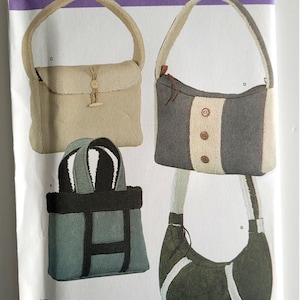 May include: Simplicity pattern 4321 featuring four different bag designs. The bags are in various styles, including a tote, a shoulder bag, and a small purse. The bags are made of soft, textured fabrics in neutral colors, with details like buttons and contrasting trim.