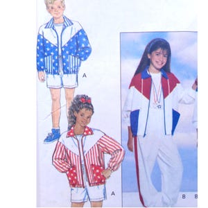 May include: An illustration of children's clothing patterns. The designs include jackets and shorts with star and stripe patterns in red, white, and blue. One jacket has a blue star pattern, while another has red stripes.
