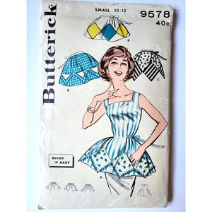 May include: A vintage Butterick sewing pattern envelope 9578 for a small size 10-12. The cover features illustrations of a sleeveless top with a striped bodice and a decorative hem, along with three variations of skirts with diamond, dot, and stripe patterns.