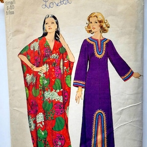 May include: A vintage Simplicity sewing pattern envelope 7315 for miss sizes small 8-10. The front displays two illustrations of floor-length dresses: one in red with a green and pink floral pattern, and one in solid purple with blue and gold trim.