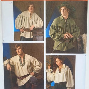 May include: A Simplicity sewing pattern envelope 3519 featuring four variations of long-sleeved shirts with gathered sleeves and loose fits. The images display shirts in beige, olive green, and off-white, some with lace-up necklines or decorative trim.