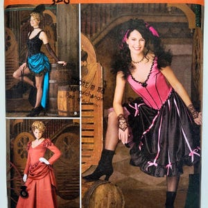 May include: A Simplicity sewing pattern envelope, number 2531, size HH 6, 8, 10, 12. The front displays three costume variations: a black and blue corset dress, a pink and black corset dress with lace gloves, and a long-sleeved red dress with a bustle.