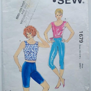 May include: Vintage Kwik Sew sewing pattern 1679 featuring illustrations of athletic wear. The pattern includes a top and leggings. The pattern is sized XS-S-M-L and is designed by Kerstin Martensson.