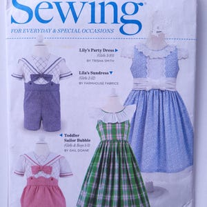 May include: A sewing pattern cover featuring four different clothing designs for children. The designs include a plaid dress, a blue and white dress, a sailor-style outfit, and a toddler's bubble. The cover text reads "Classic Sewing" and "Summer 2018".