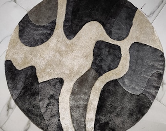 Alfombra redonda gris de lana tejida a mano – Diseño abstracto con efecto de tinta derramada
