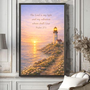 May include: Framed artwork featuring a lighthouse on a rocky shore at sunset. The sky transitions from purple to orange, reflecting on the water. Text reads "The Lord is my light and my salvation whom shall I fear Psalm 27:1."