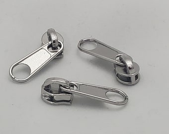 Silver zipper pulls for #3 nylon coil zipper by the yard