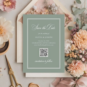 May include: A sage green wedding invitation with the text "Save the Date" and details for Olivia & Joseph. The invitation is surrounded by flowers, an envelope, and decorative items. The invitation includes a QR code.