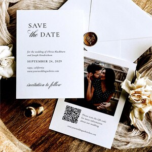May include: A wedding invitation suite featuring a "Save the Date" card with the wedding date, names, and website. A photo of a couple kissing is included. A QR code is present for more information. Gold rings and a wax seal are also visible.