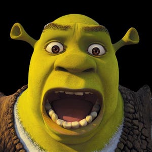 May include: A close-up of the animated character Shrek with a surprised expression. Shrek's green skin contrasts with his open mouth and large brown eyes. He wears a brown vest over a white shirt, set against a black background.