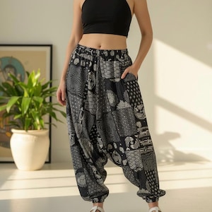 May include: Black halter top and patterned harem pants. The pants feature a patchwork design in black and white, with a comfortable, loose fit. The pants have a gathered ankle and pockets. The model is wearing white sandals.