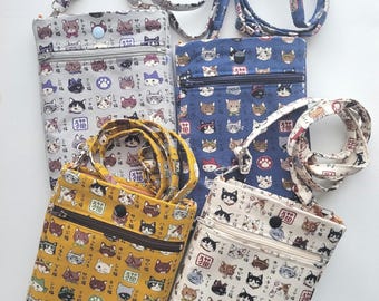 Crossbody phone bag with a zipper pocket