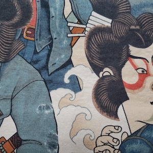 May include: A vintage Japanese woodblock print featuring two figures in traditional clothing. The figures are set against a background of stylised waves. The print is in shades of blue, brown, and red.