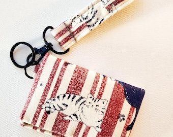 Two pocket card case with a strap - love more worry less