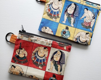 Small wallet with a key ring - 5" wide X 4" long, a zipper pouch with 1 inner pocket, Japanese sumo wrestler print