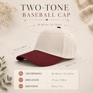 May include: A two-tone baseball cap with a cream-colored crown and a dark red brim. Text indicates a circumference of 22-23.6 inches, a brim length of 2.96 inches, and a brim width of 7 inches. The cap features a button top and stitched panels.
