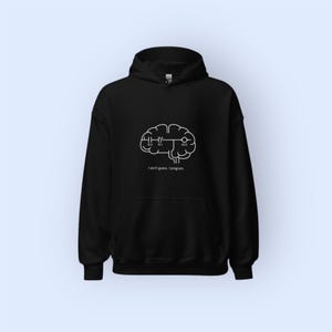 May include: Black hooded sweatshirt with a white brain graphic and the text "I don't guess. I program." The design features a brain with circuit-like elements, perfect for programmers and tech enthusiasts.